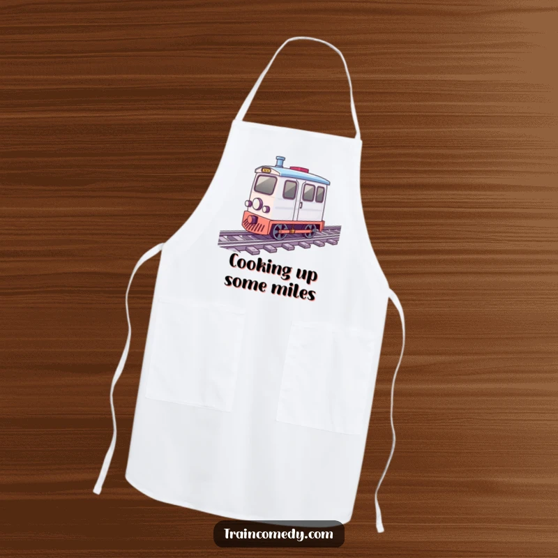 Funny apron showing a small train car with wheels spinning energetically along tracks, great for playful cooking.