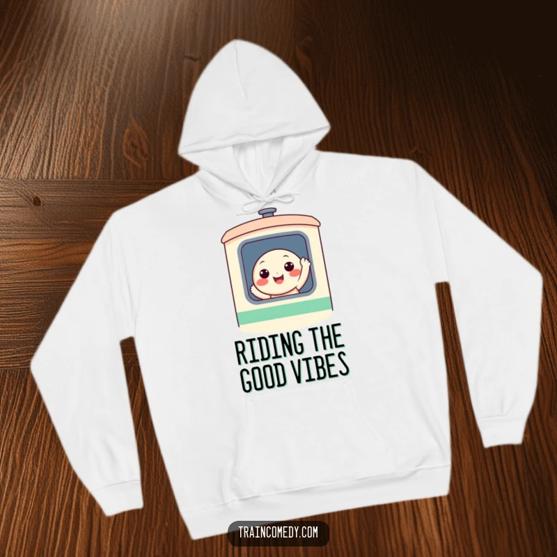 A cheerful, round, smiling character waving from a stylized train window, printed on a soft and warm hoodie for ultimate comfort.